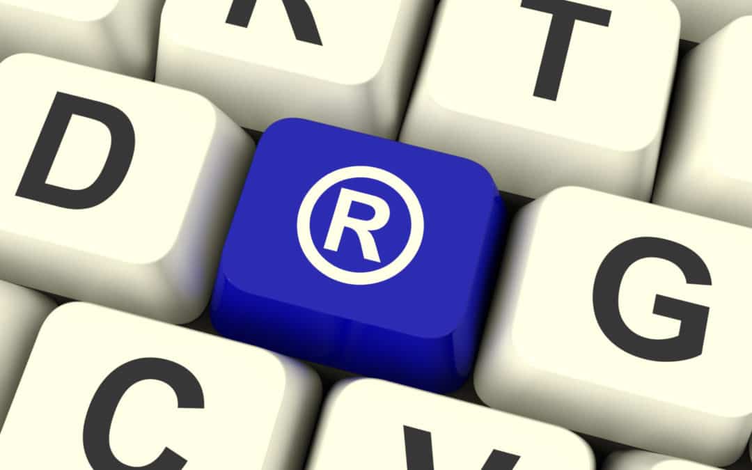 A blue keyboard key has the registered trademark symbol.