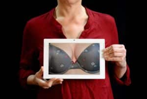A woman holds up a scandalous picture.